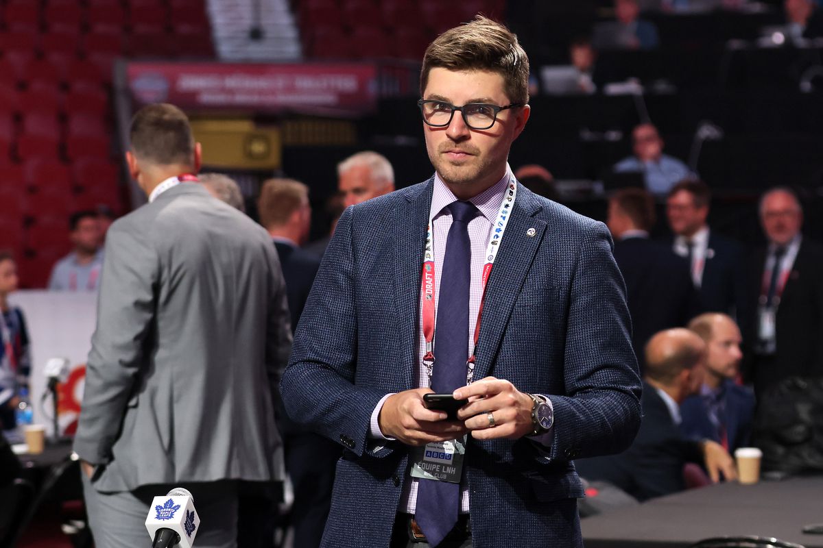 General manager Kyle Dubas of the Toronto Maple Leafs looks on from the draft floor prior to Round Two of the 2022 Upper Deck NHL Draft at Bell Centre on July 08, 2022 in Montreal, Quebec, Canada.