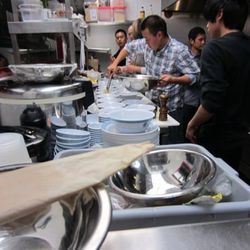The chef team works on the dishes for the ChowDownTown.