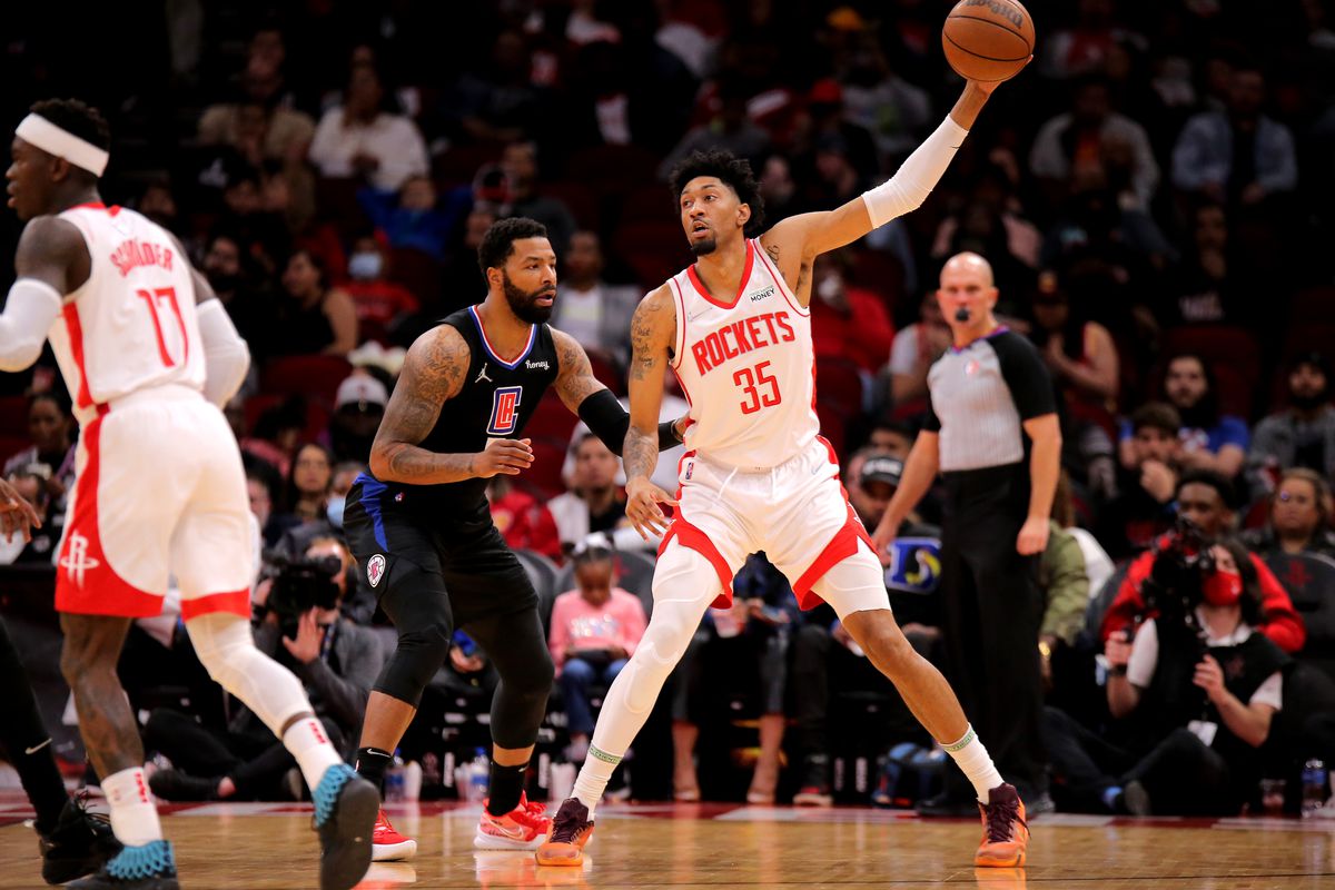 Houston Rockets center Christian Wood (35) handles the ball while LA Clippers forward Marcus Morris Sr. (8) defends during the second quarter at Toyota Center.