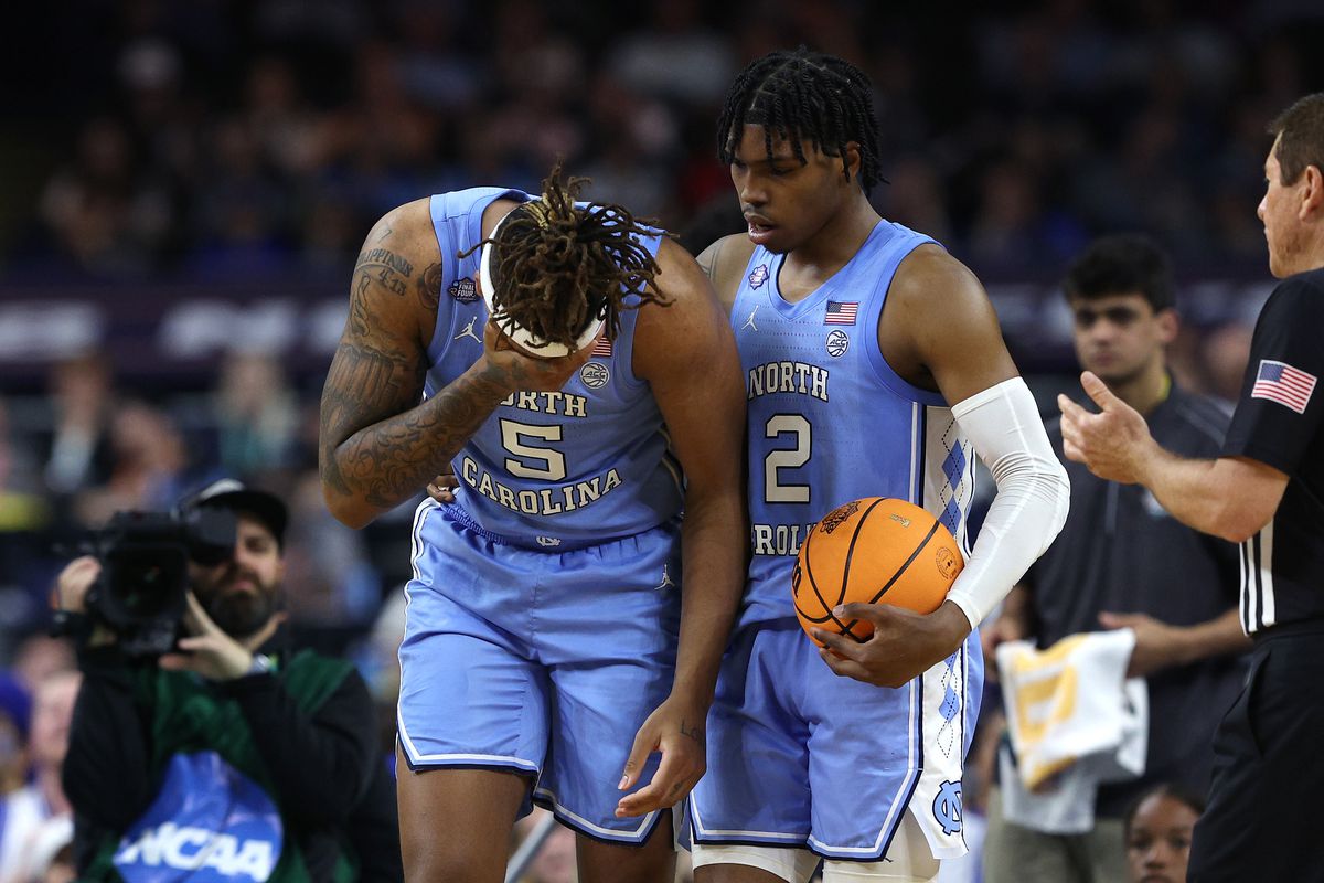 Armando Bacot and Caleb Love of the North Carolina Tar Heels react in the second half of the game against the Duke Blue Devils during the 2022 NCAA Men’s Basketball Tournament Final Four semifinal at Caesars Superdome on April 02, 2022 in New Orleans, Louisiana.