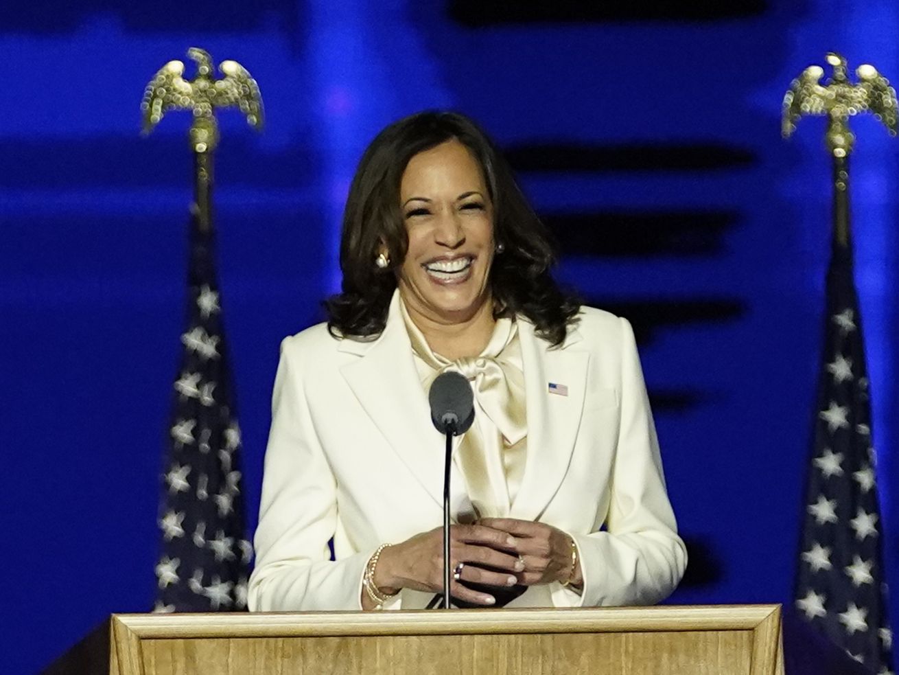 Kamala Harris smiles at a podium in the Chase Center.