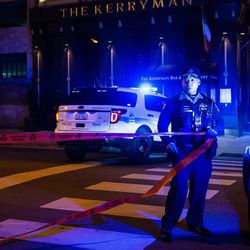 Chicago Police investigate the scene where an off-duty officer was fatally shot near Huron and Clark. | Tyler LaRiviere/Sun-Times