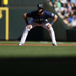 SEATTLE, WASHINGTON - SEPTEMBER 05: Mitch Haniger #17 of the Seattle Mariners leads off first base during the first inning against the Chicago White Sox at T-Mobile Park on September 05, 2022 in Seattle, Washington.