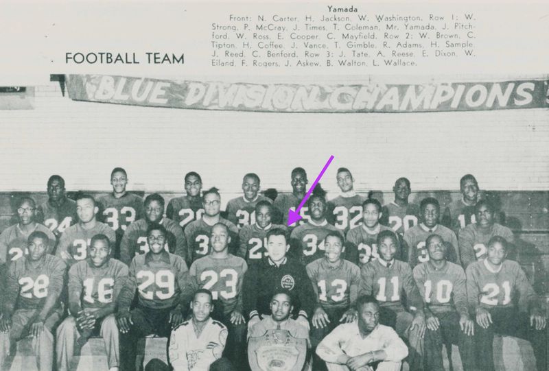 Coach Yosh Yamada (under arrow) with his winning Chicago Public League Blue Division players on the 1958 Englewood High School Eagles football team.
