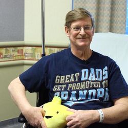 Lynn Clark, 57, holds his yellow liver pillow on Tuesday, Feb. 16, 2016. Clark's son, Jason, 28, donated part of his liver to his father. It was the first living donor liver transplant at University Hospital. Humor is helping the two deal with the stress of the surgery.   