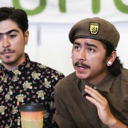 Anthony Anco, a local community activist, left, listens as Carlos Martinez, with the Brown Berets, answers a question about a protest over the inland port that turned violent earlier this week during a press conference Sierra Club offices in Salt Lake City on on Thursday, July 11, 2019.