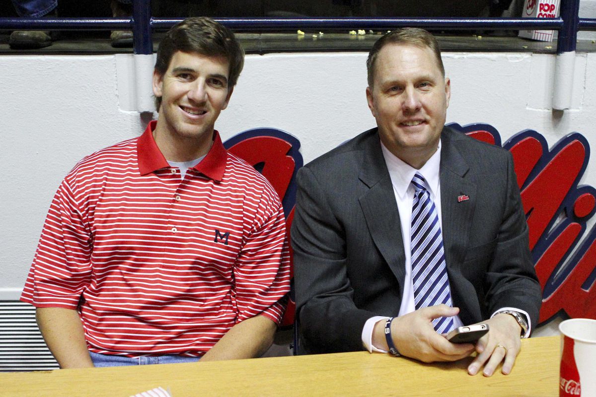 Is Hugh Freeze already texting 'croots? He can't even pay attention to Eli Manning? Man, what a machine this guy is.