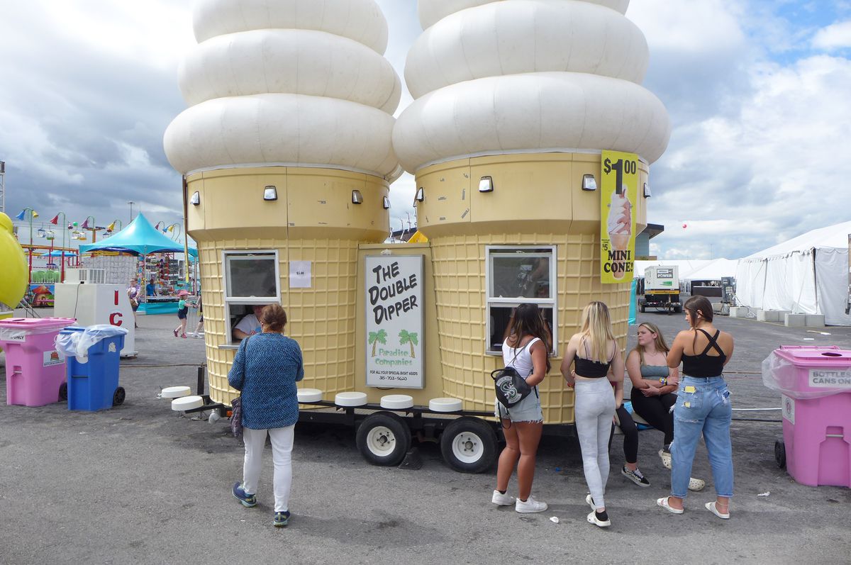 An ice cream stand shaped like two giant vanilla soft serve cones.
