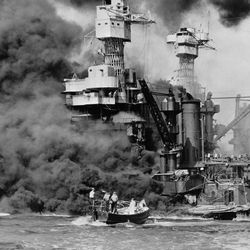 FILE - In this Dec. 7, 1941 photo made available by the U.S. Navy, a small boat rescues a seaman from the USS West Virginia burning in the foreground in Pearl Harbor, Hawaii, after Japanese aircraft attacked the military installation. A few dozen survivors of the Japanese attack on Pearl Harbor plan to gather in Hawaii, Wednesday, Dec. 7, 2016, to remember those killed 75 years ago. (U.S. Navy via AP, File)