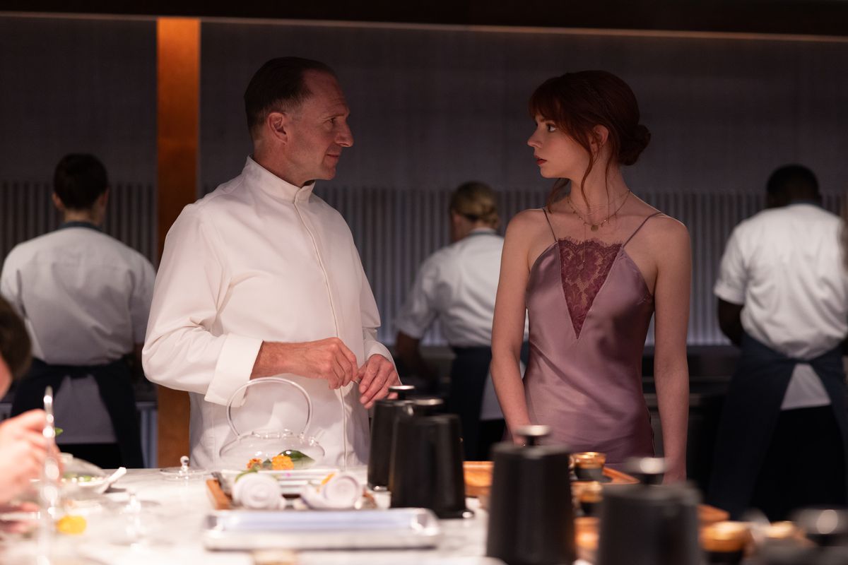 Ralph Fiennes and Anya Taylor-Joy in the film THE MENU.