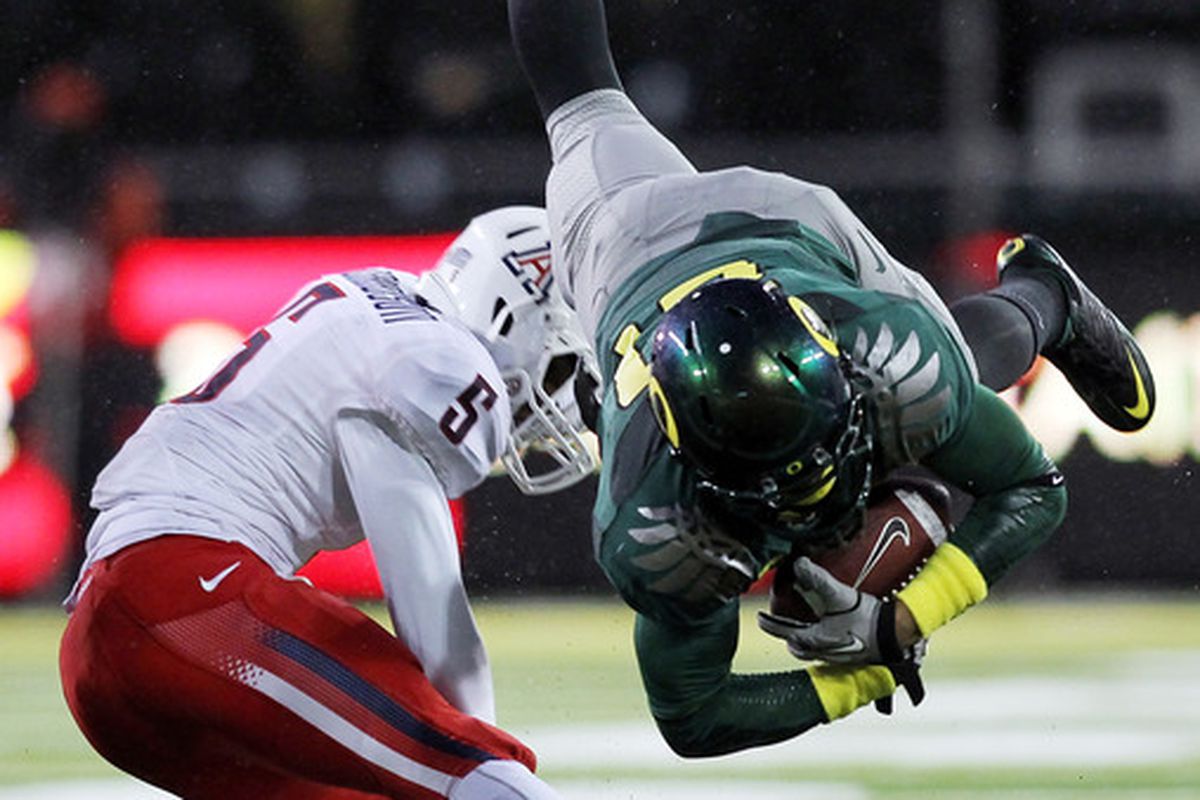 EUGENE OR - NOVEMBER 26:  LaMichael James #21 of the Oregon Ducks is tackled by Shaquille Richardson #5 of the Arizona Wildcats on November 26 2010 at the Autzen Stadium in Eugene Oregon.  (Photo by Jonathan Ferrey/Getty Images)