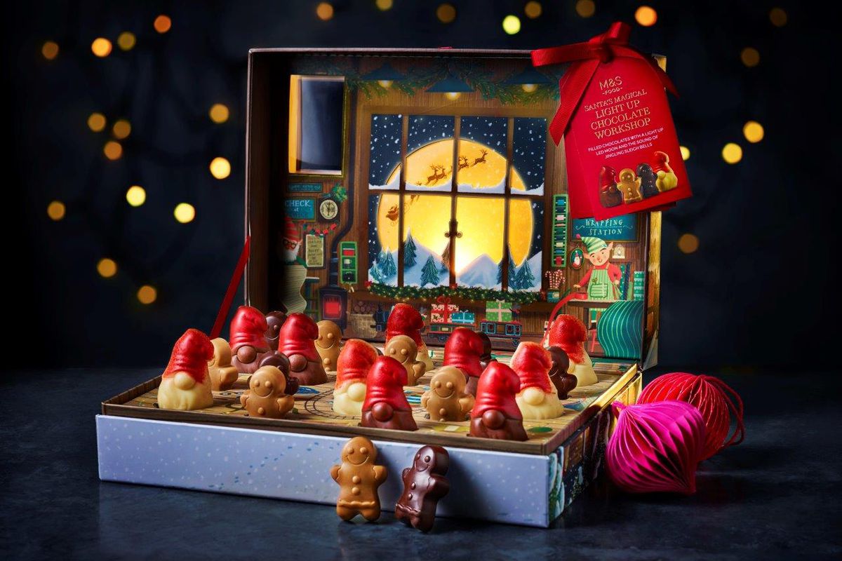 A box of Christmas chocolates shaped like elves and gingerbreadmen