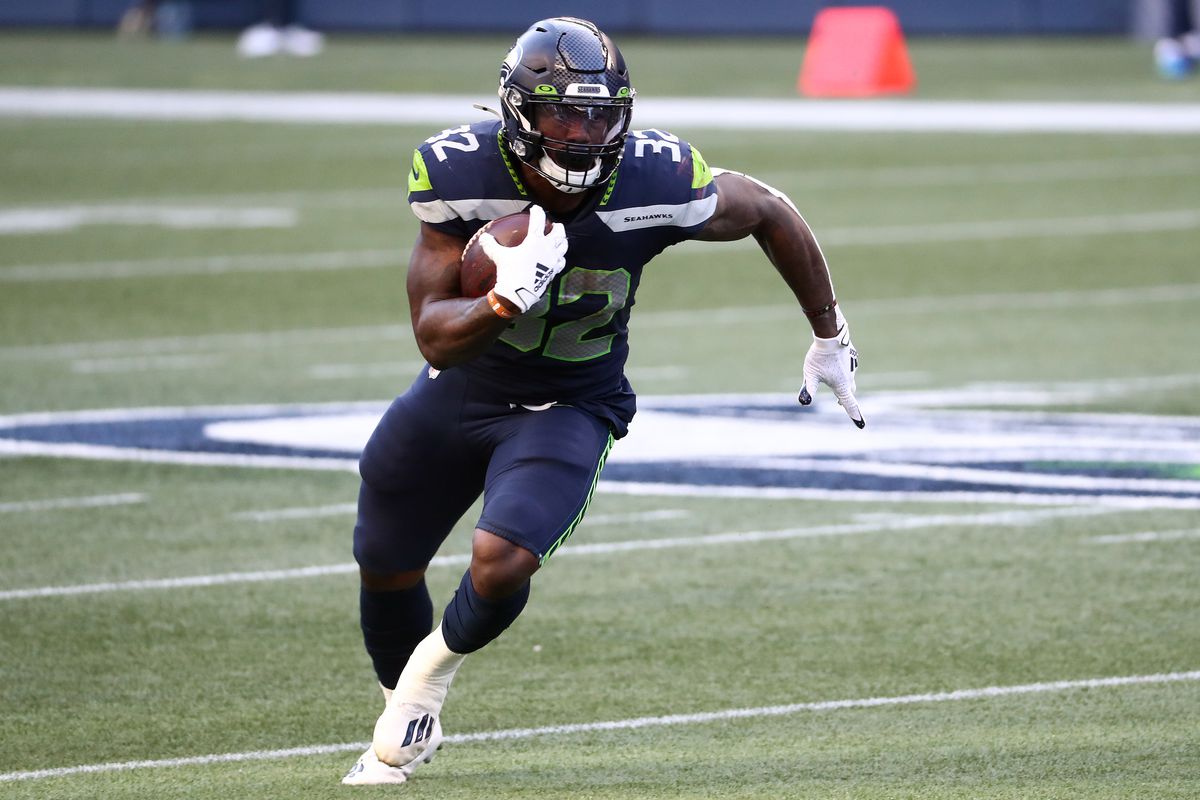 Chris Carson #32 of the Seattle Seahawks runs with the ball in the first quarter against the New England Patriots at CenturyLink Field on September 20, 2020 in Seattle, Washington.