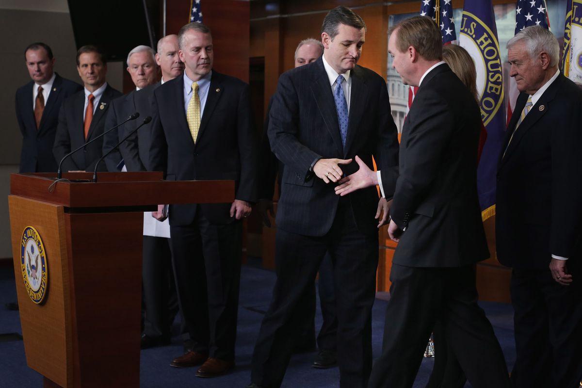 Ted Cruz and Mick Mulvaney shake hands in 2015.