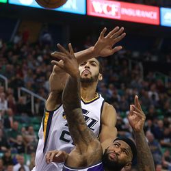 Utah Jazz center Rudy Gobert (27) defends Sacramento Kings forward DeMarcus Cousins (15) as the Jazz and the Kings play at Vivint Smart Home arena in Salt Lake City on Wednesday, Dec. 21, 2016.