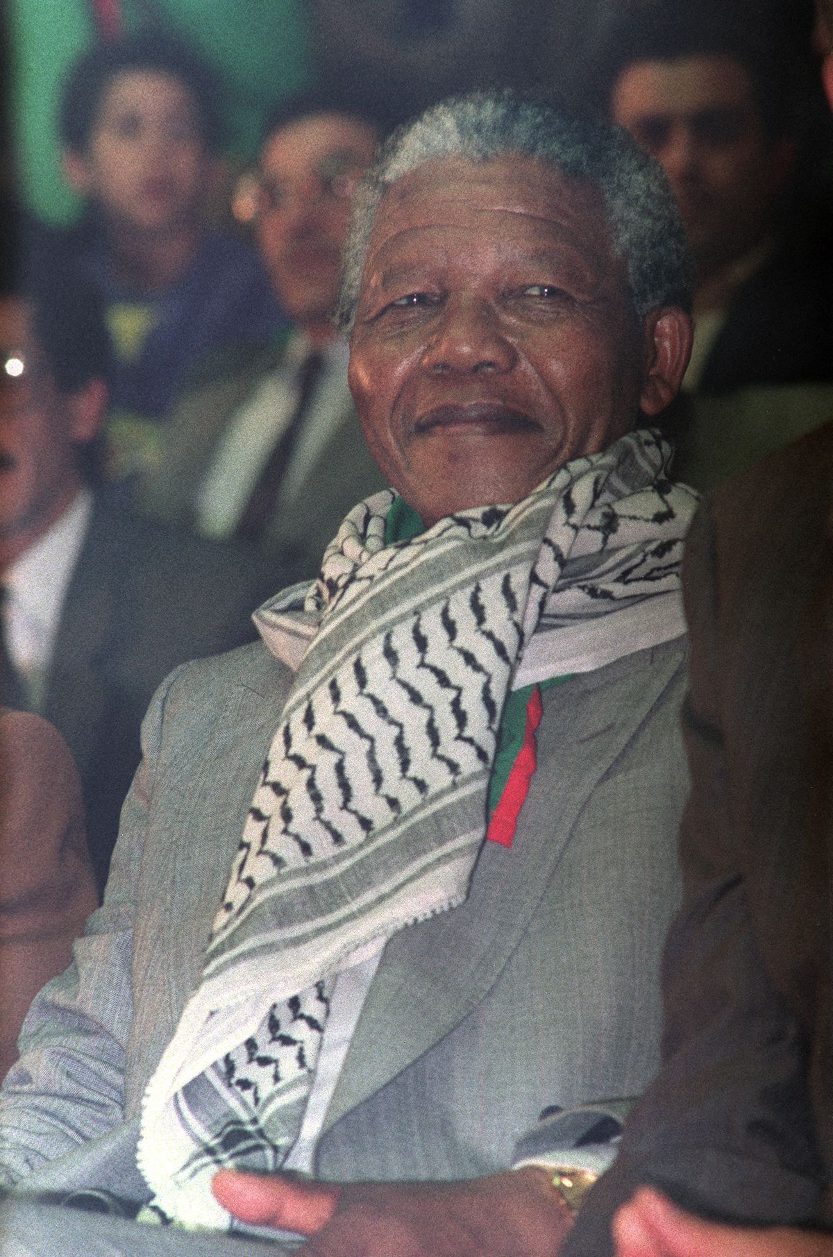Nelson Mandela is pictured wearing a keffiyeh around his neck.