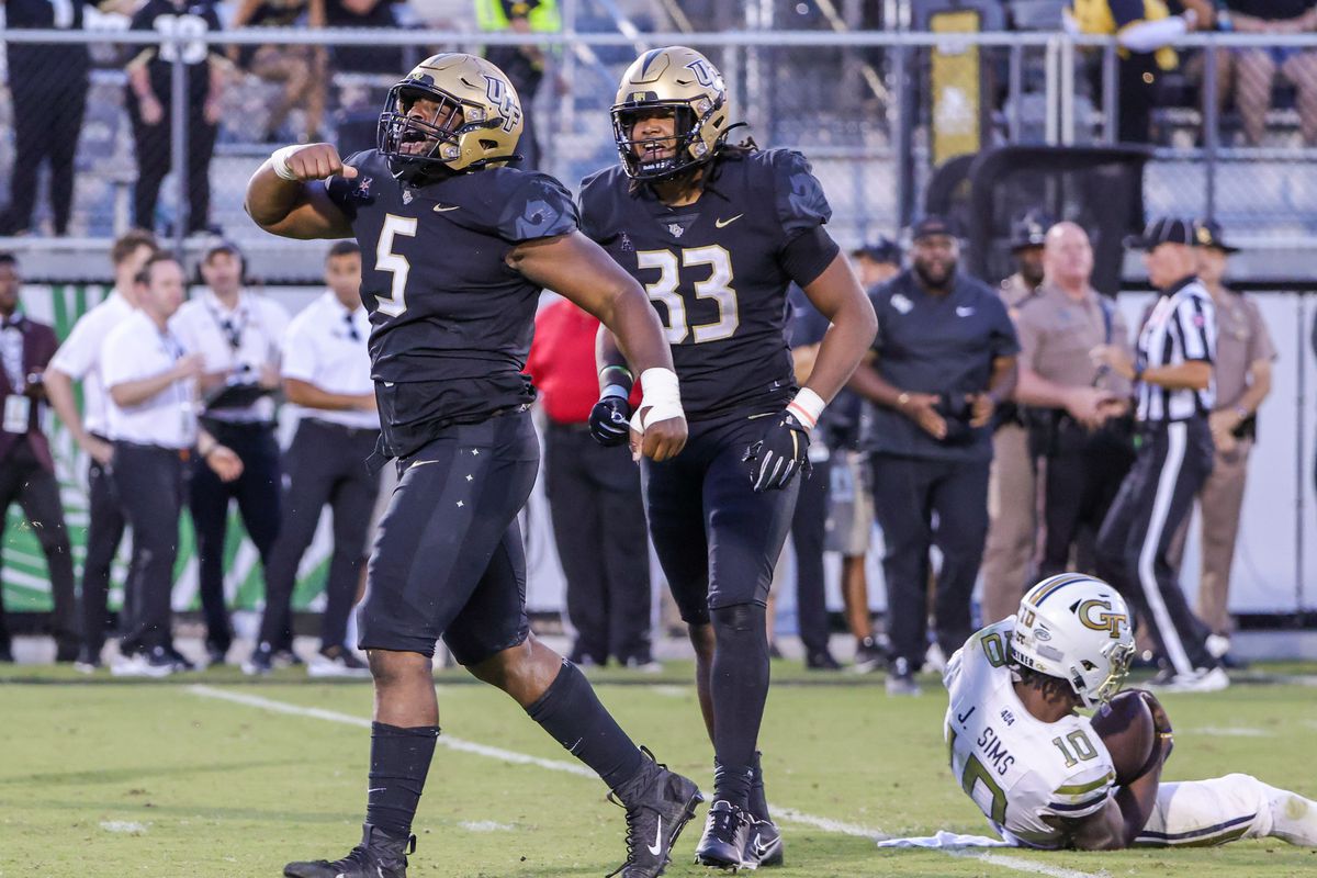 UCF Knights defensive tackle Ricky Barber celebrates after sacking Georgia Tech Yellow Jackets quarterback Jeff Sims during the second half at FBC Mortgage Stadium.
