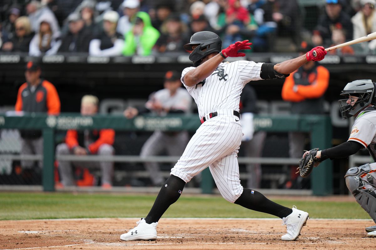 Eloy Jimenez of the Chicago White Sox hits a single in the fourth inning during the game between the San Francisco Giants and the Chicago White Sox at Guaranteed Rate Field on Monday, April 3, 2023 in Chicago, Illinois.
