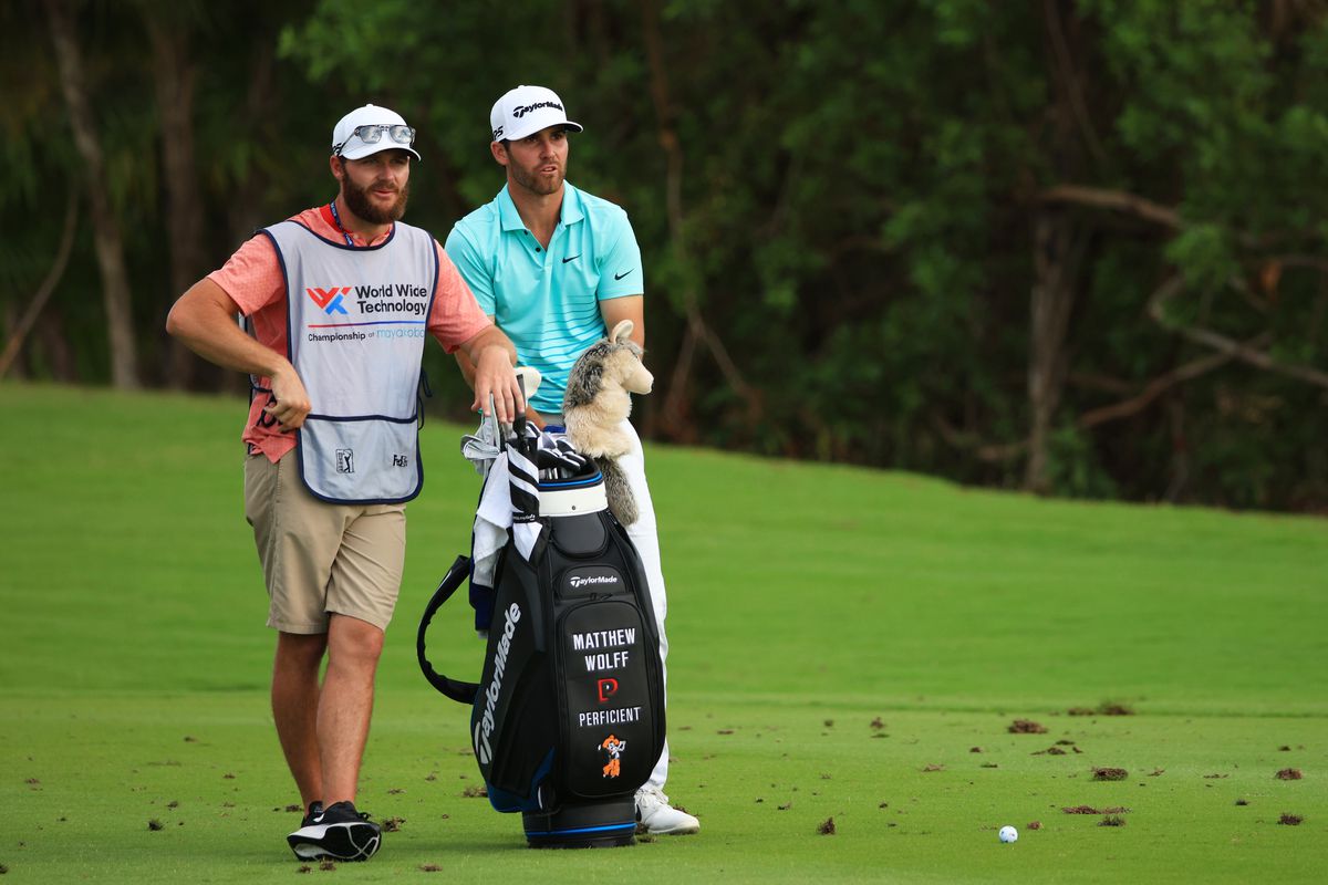 Matthew Wolff of the United States talks with his caddie Nick Heinen on the 17th hole during the second round of the World Wide Technology Championship at Mayakoba on El Camaleon golf course on November 05, 2021 in Playa del Carmen.
