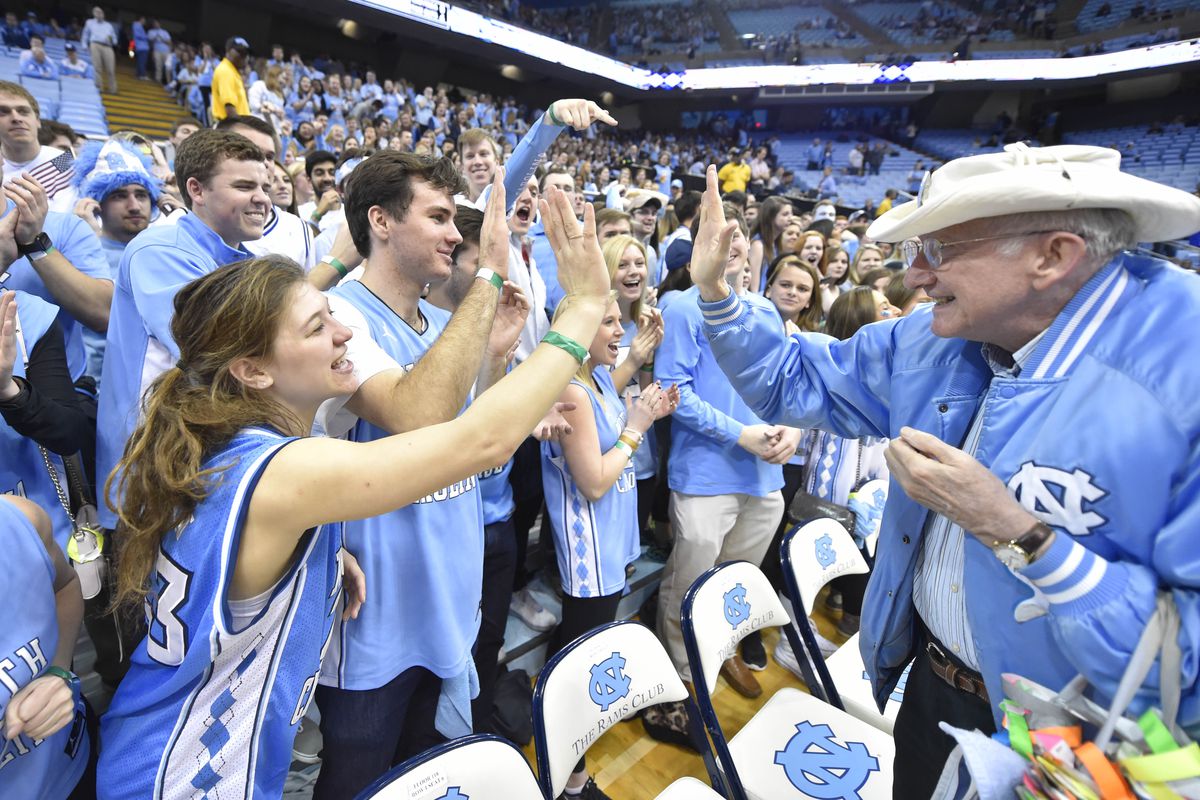 Feb 17, 2016; Chapel Hill, NC, USA; A Tar Heel fan high fives through the student section before the game at Dean E. Smith Center. 