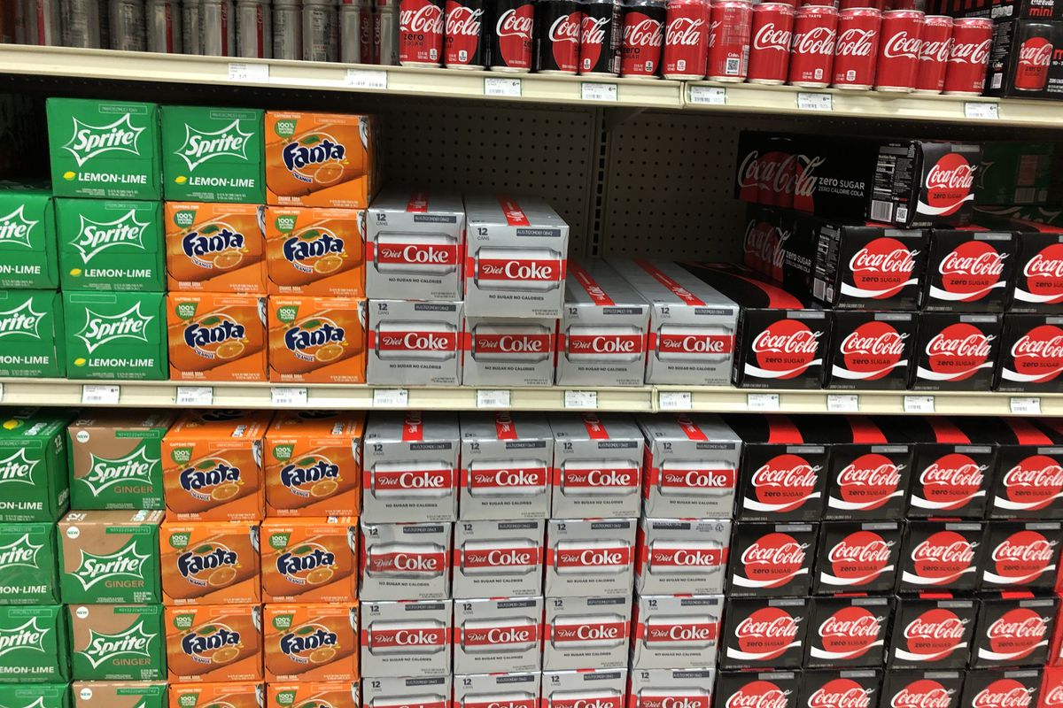 Cans of Coke products on a shelf at Sunset Foods in Northbrook.