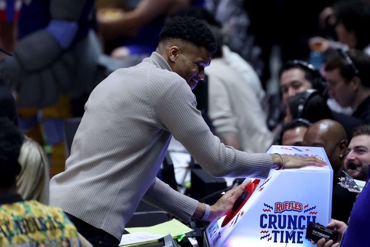 Coach Giannis Antetokounmpo of Team Dwayne hits the crunch time button against Team Ryan during the fourth quarter in the 2023 NBA All Star Ruffles Celebrity Game at Vivint Arena on February 17, 2023 in Salt Lake City, Utah.