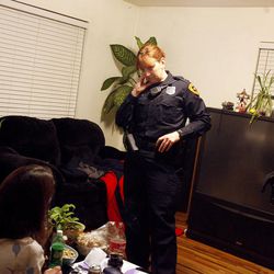 Salt Lake police officers Jennifer Choate and Scott Hall respond to a call in Sugar House on January 27, 2007. Neighbors called the police after hearing a loud argument coming from the home.