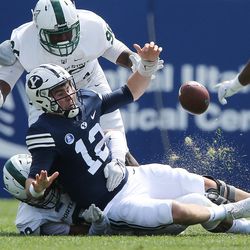 Brigham Young Cougars QB Tanner Mangum fumbles the ball against Portland State in Provo on Saturday, Aug. 26, 2017.