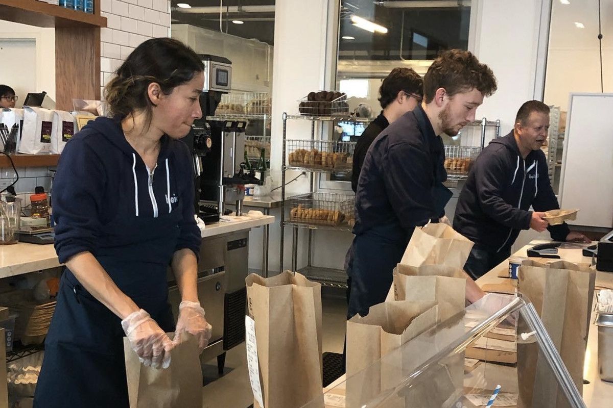 A team at Boichik Bagels in Berkeley bag up bagel orders at the new Sixth Street facility