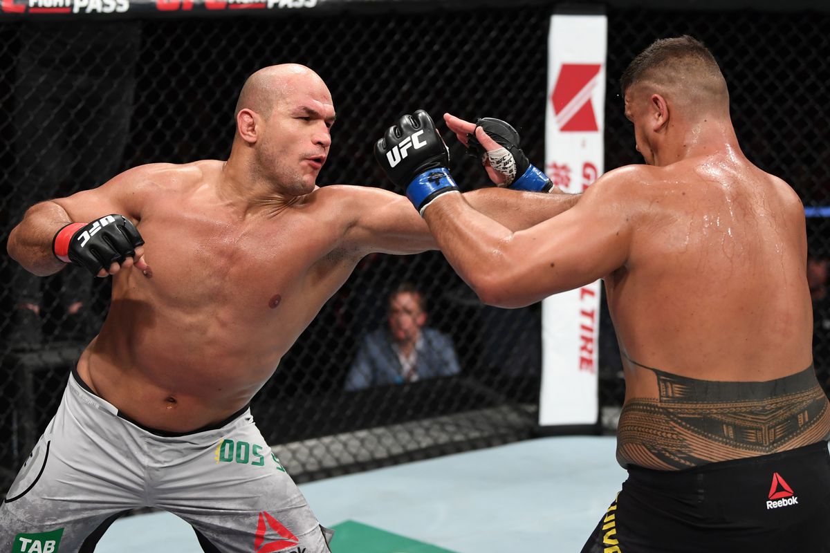 Junior Dos Santos of Brazil punches Tai Tuivasa of Australia in their heavyweight bout during the UFC Fight Night event inside Adelaide Entertainment Centre on December 2, 2018 in Adelaide, Australia.