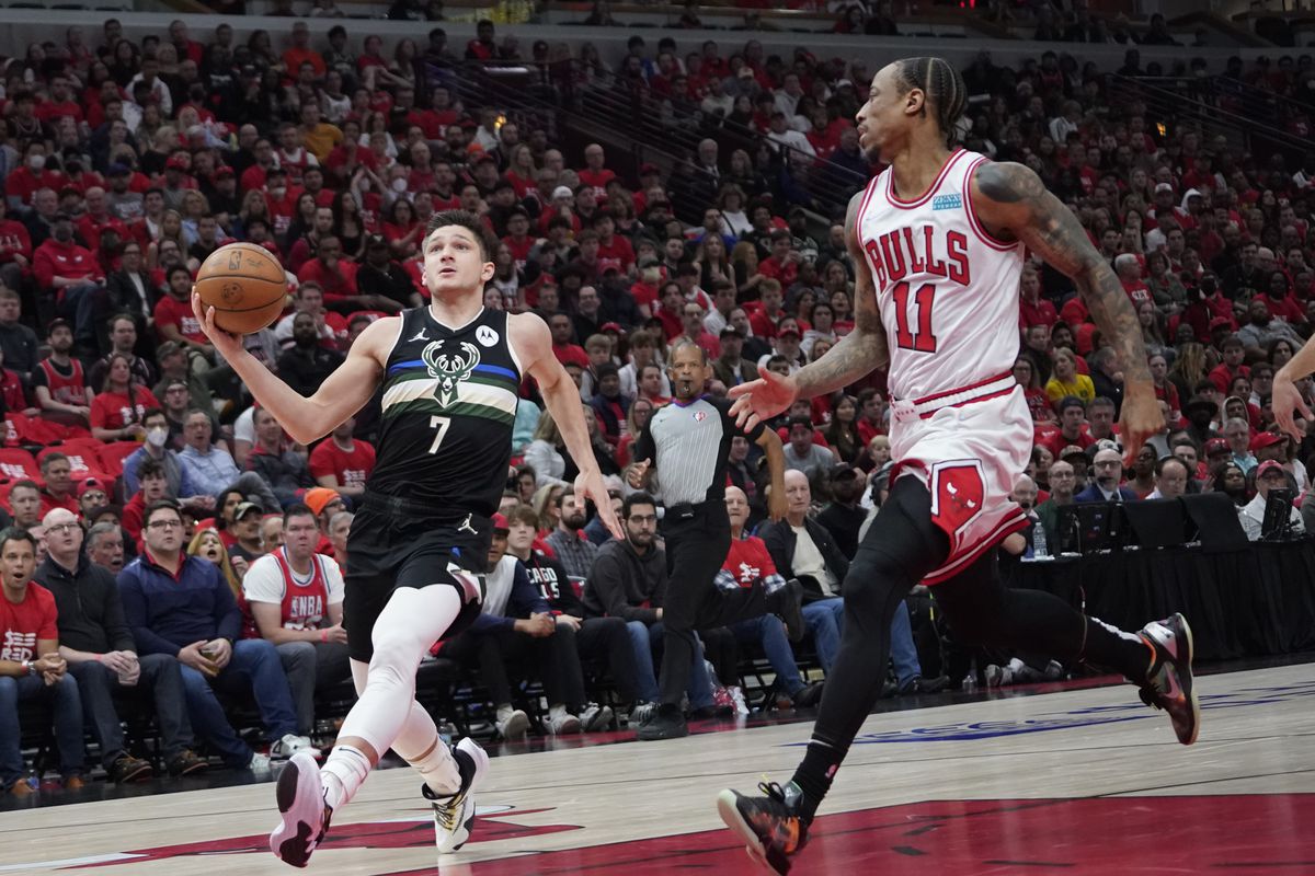 Milwaukee Bucks guard Grayson Allen (7) drives to the basket as Chicago Bulls forward DeMar DeRozan (11) defends him in the first half during game four of the first round for the 2022 NBA playoffs at United Center.