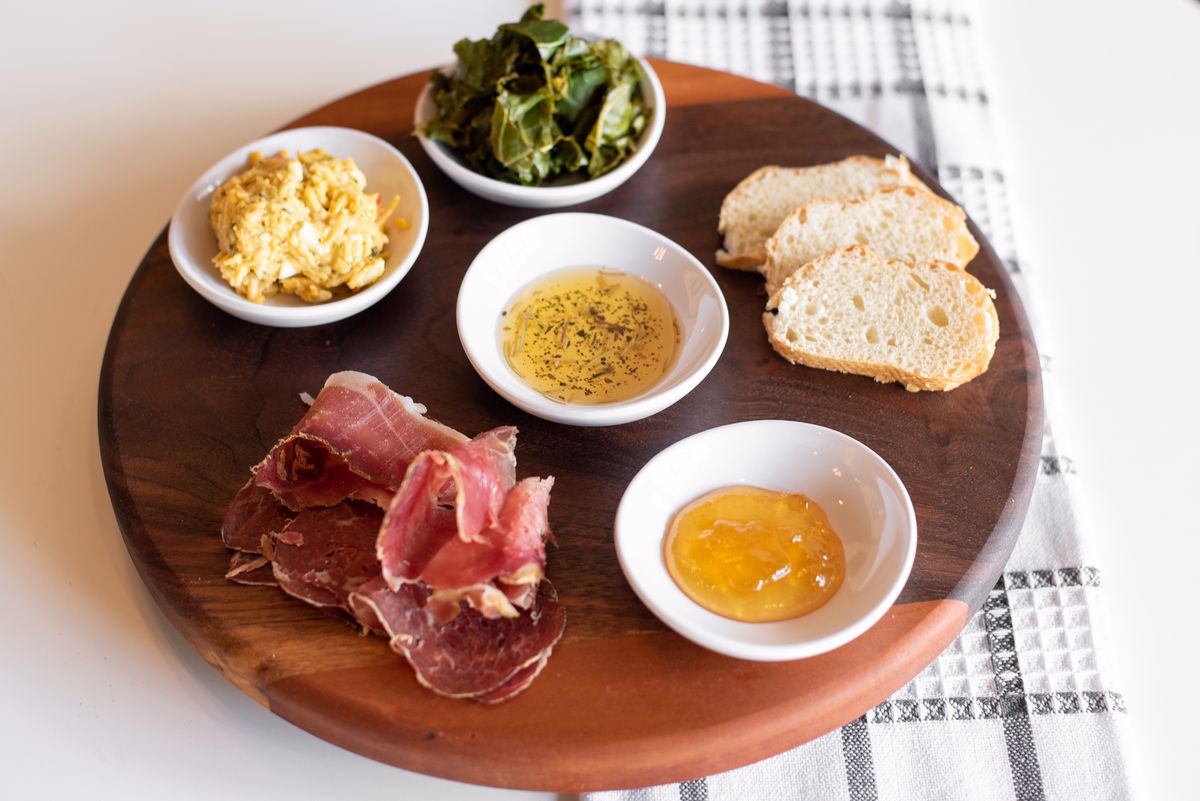 Charcuterie board with pickled collards and pimento cheese from Suga’s Cheese Shoppe and Cafe in Powder Springs, Ga. 