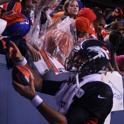 Broncos QB Brock Osweiler signs autographs after the summer scrimmage