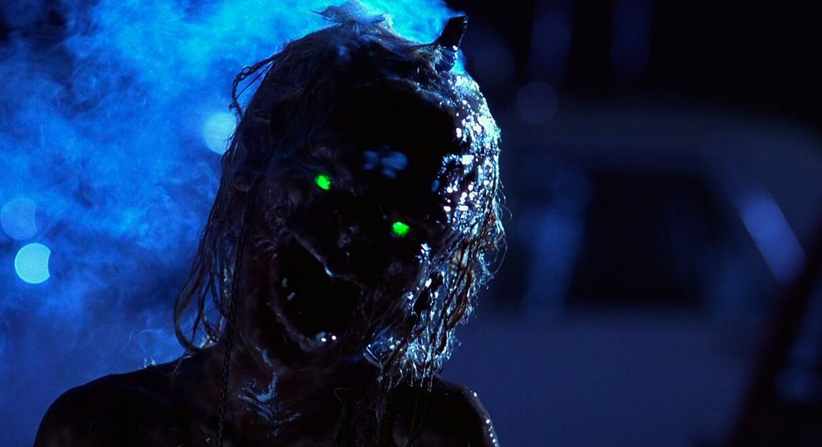 A terrifying skeletal creature with stringy hair and bright yellow/green eyes in Tales From the Crypt: Demon Knight.