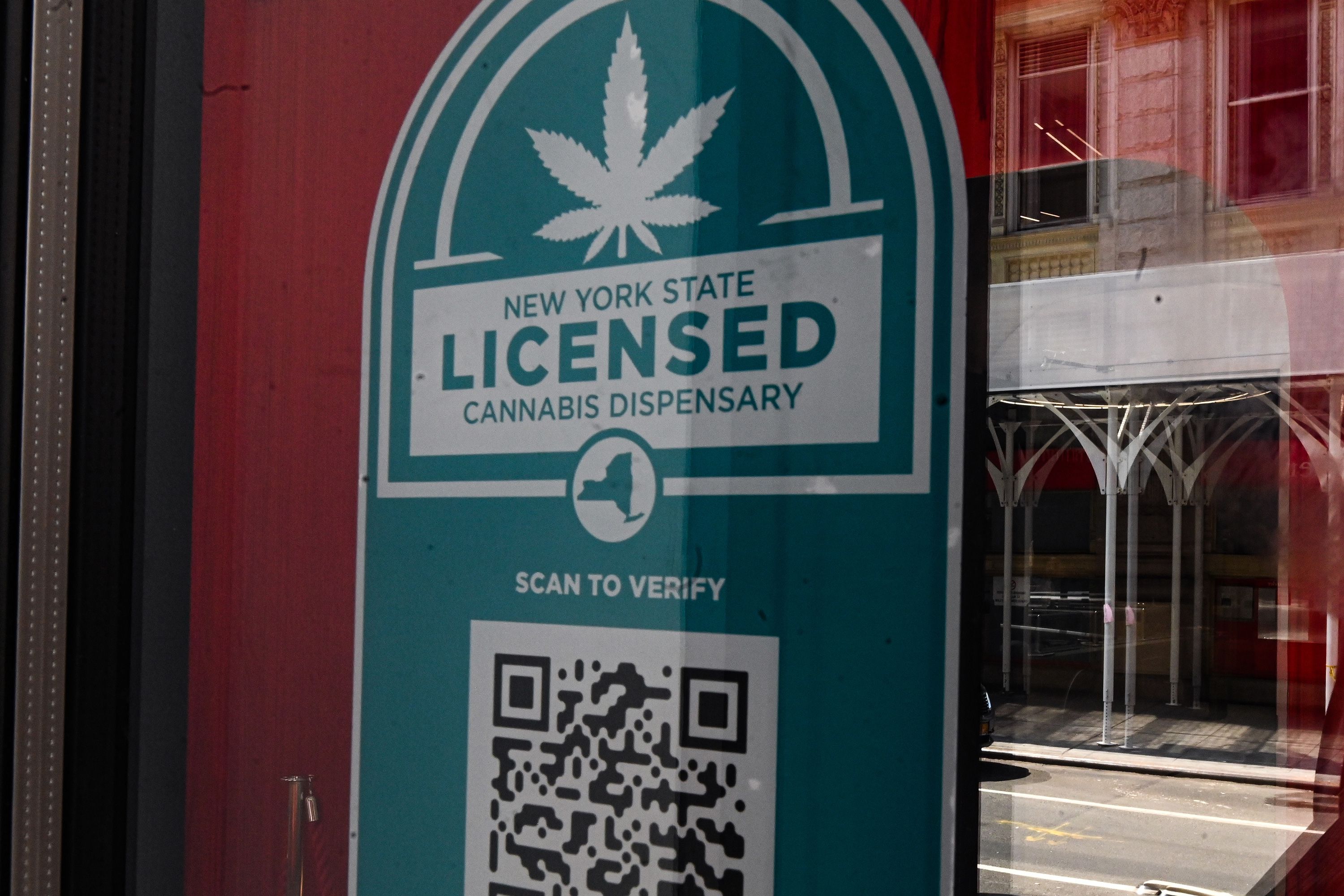 An under-construction Union Square cannabis dispensary displays its state license.