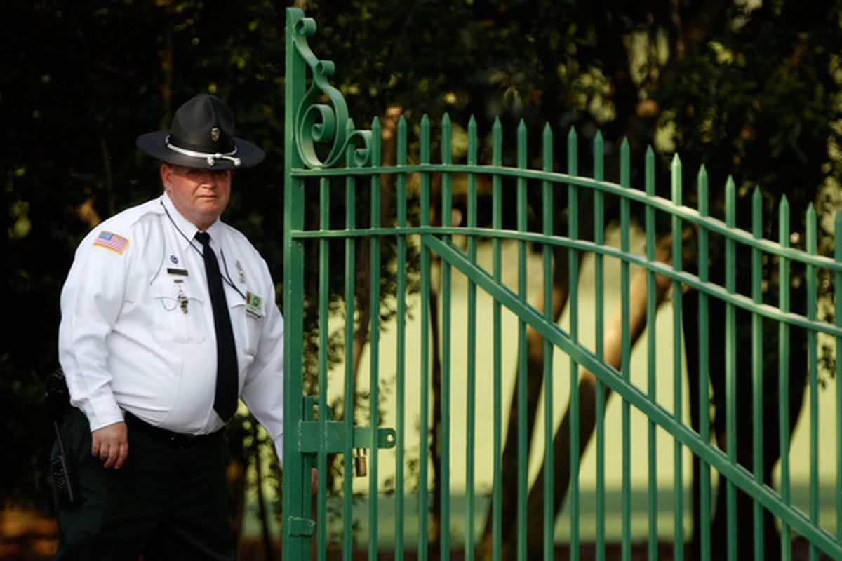 This Augusta National security guard doesn't look like he takes too kindly to paparrazzi's