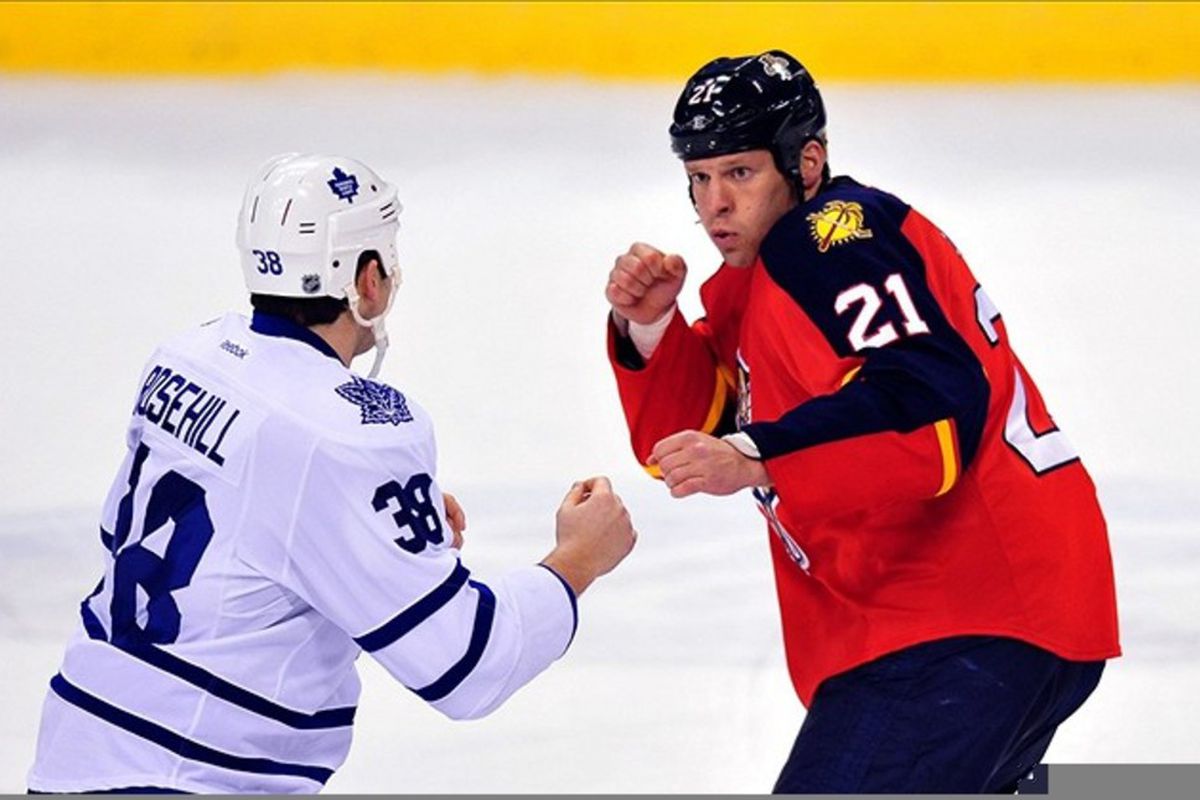 March 13, 2012: Sunrise, FL, USA; Toronto Maple Leafs left wing Jay Rosehill (38) and Florida Panthers right wing Krys Barch (21) both fight during the first period at the BankAtlantic Center. Mandatory Credit: Steve Mitchell-US PRESSWIRE