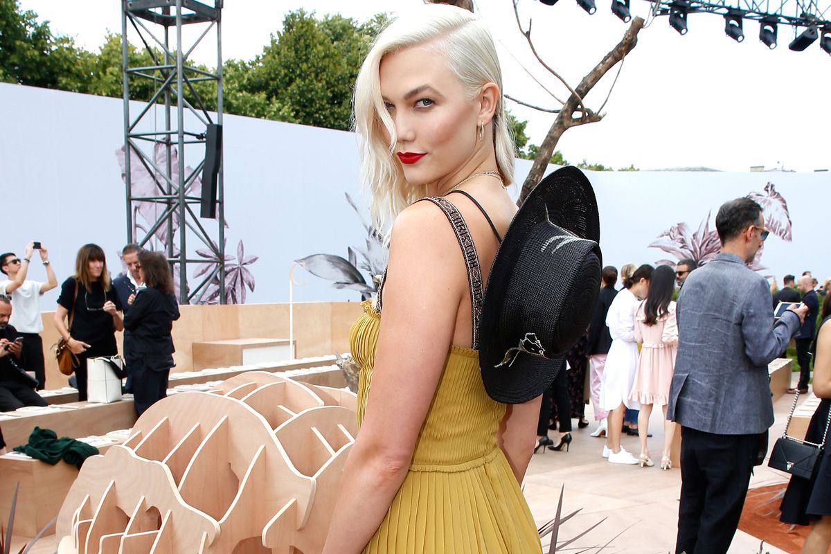 Karlie Kloss in a mustard-colored Dior dress.