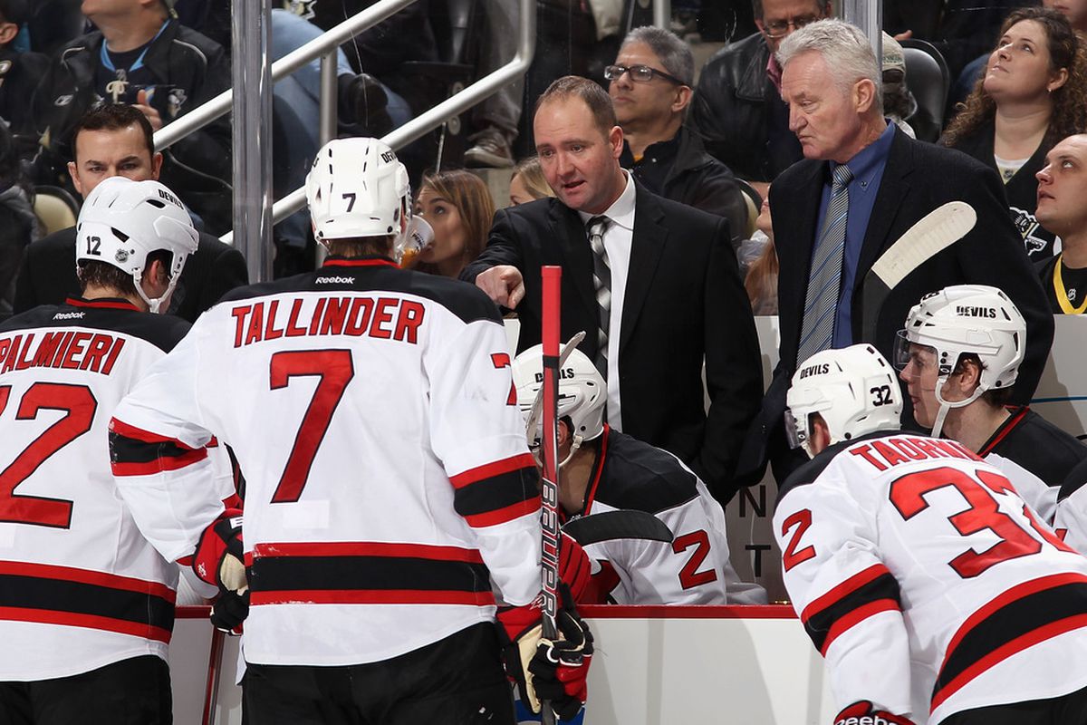 What Peter DeBoer isn't saying here: "OK, Henrik Tallinder, your next trick is to somehow not get pinned back in your end with Nick Palmieri and Matt Taormina on the ice with you." (Photo by Christian Petersen/Getty Images)