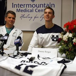 Utah State University basketball player Danny Berger speaks with the press during his recovery at Intermountain Medical Center in Murray, Dec. 7. At left is Dr. Jared Bunch of the Intermountain Medical Center Heart Institute.