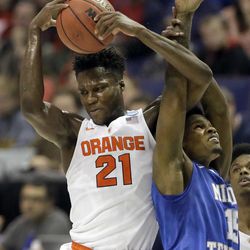 FILE - In this March 20, 2016, file photo, Syracuse's Tyler Roberson, left, and Middle Tennessee's Aldonis Foote reach for a rebound during the first half in a second-round men's college basketball game in the NCAA Tournament, in St. Louis. Syracuse has a negative rebound margin this season and ranks 14th out of 15 Atlantic Coast Conference teams in that category. But the Orange outrebounded Dayton 48-28 and Middle Tennessee 37-35 in its first two NCAA Tournament games