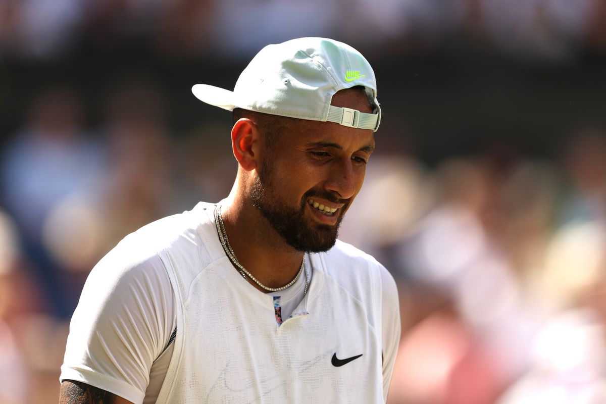 Nick Kyrgios of Australia looks on against Novak Djokovic of Serbia during their Men’s Singles Final match on day fourteen of The Championships Wimbledon 2022 at All England Lawn Tennis and Croquet Club on July 10, 2022 in London, England.