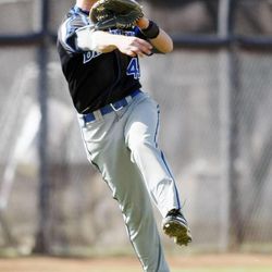 Bingham's Austin Florez makes a running throw to first base for an out as American Fork and Bingham play Wednesday, April 24, 2013. Bingham won 5-3.