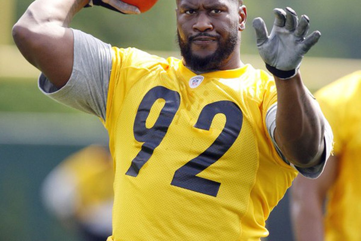 May 22, 2012; Pittsburgh, PA, USA; Pittsburgh Steelers linebacker James Harrison (92) tosses a football during organized team activities at the Steelers training facility. Mandatory Credit: Charles LeClaire-US PRESSWIRE