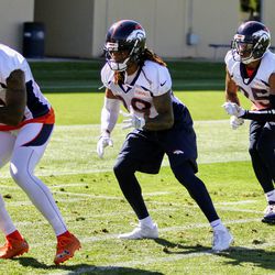 The Denver Broncos secondary running through drills during the first day of Broncos training camp. 