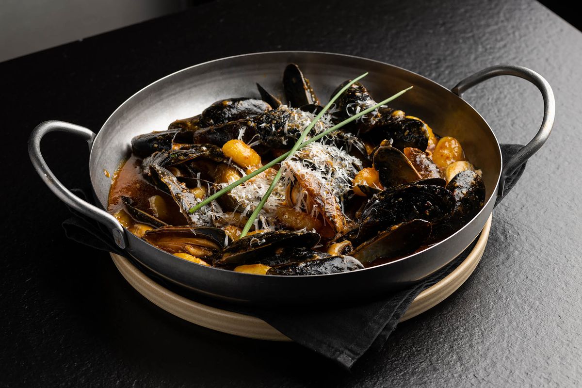 Black mussels in a steel pot at a new restaurant.