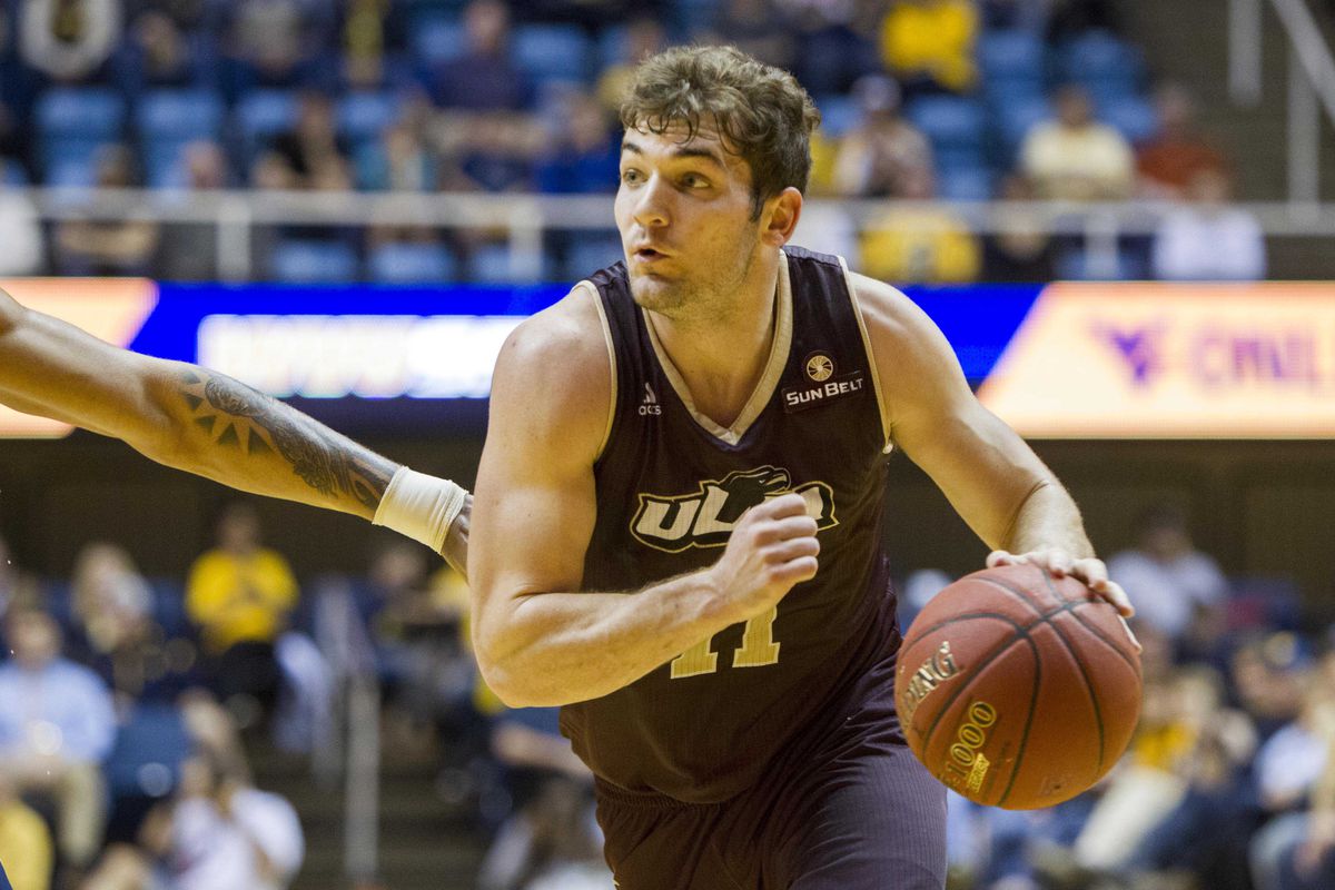 Warhawks guard Nick Coppola drives past a West Virginia defender in December, 2015