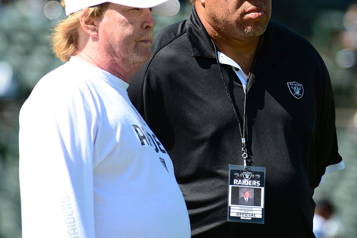 Oakland Raiders owner Mark Davis (left) and general manager Reggie McKenzie (right) watch before the game