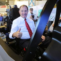 Utah Gov. Gary R. Herbert gives a thumbs up as he sits in the seat Wednesday, Oct. 7, 2015, of an F-35 cockpit demonstrator, at the University of Utah. Lockheed Martin and Hill Air Force Base, teamed up to bring the demonstrator to the Rio Tinto Kennecott Mechanical Engineering Building. 
