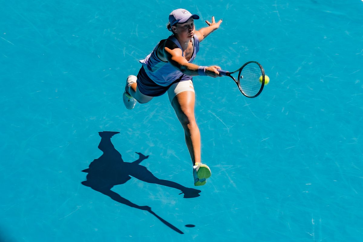 Ashleigh Barty of Australia lunges to play a forehand in her Women’s Singles Quarterfinals match against Karolina Muchova of the Czech Republic during day 10 of the 2021 Australian Open at Melbourne Park on February 17, 2021 in Melbourne, Australia.